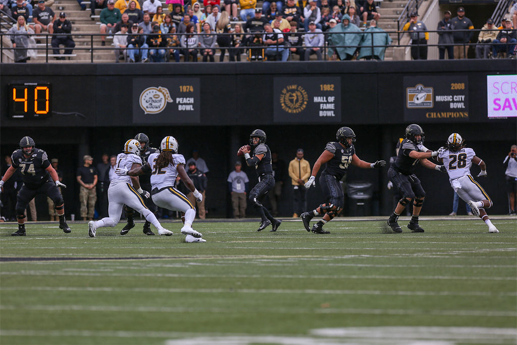 Vanderbilt quarterback Mo Hasan prepares to throw the ball
